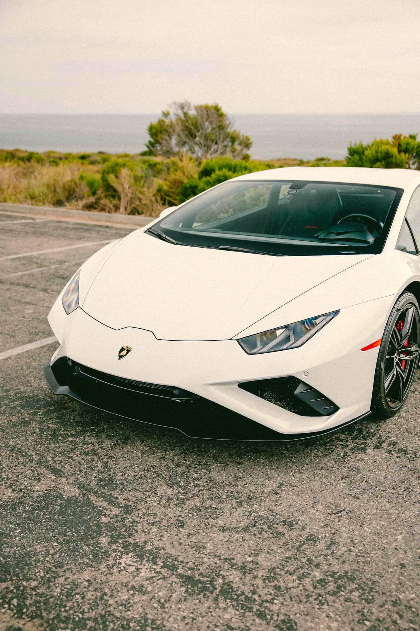 White Lamborghini Huracán, front three-quarter in Orange County daylight
