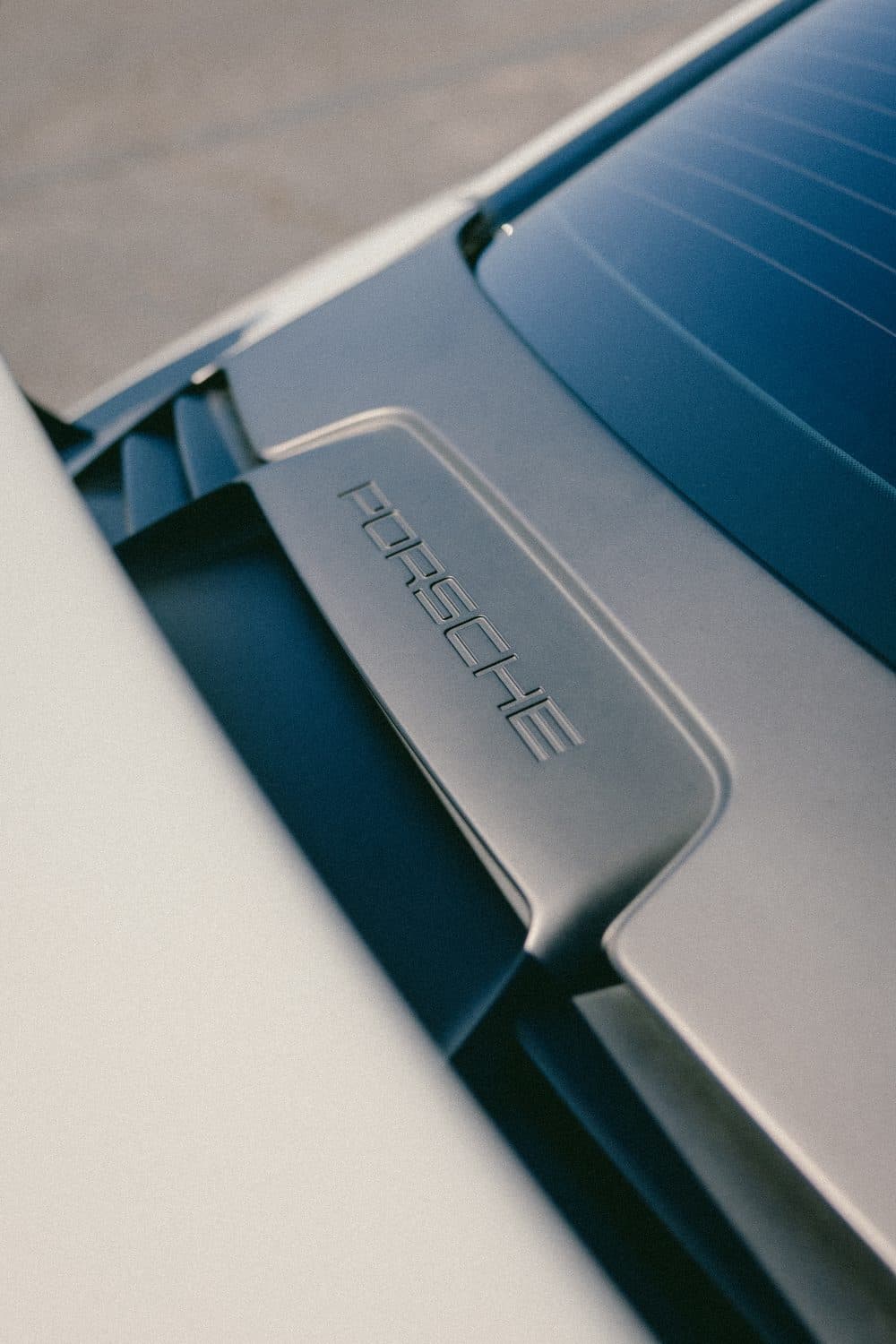 Detail of the GT3 RS engine cover with the recessed PORSCHE lettering above the exhaust vents