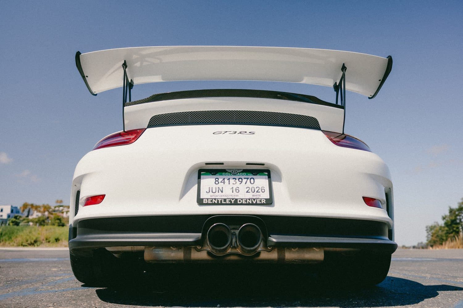 White Porsche 911 GT3 RS, rear wing and center-exit exhaust